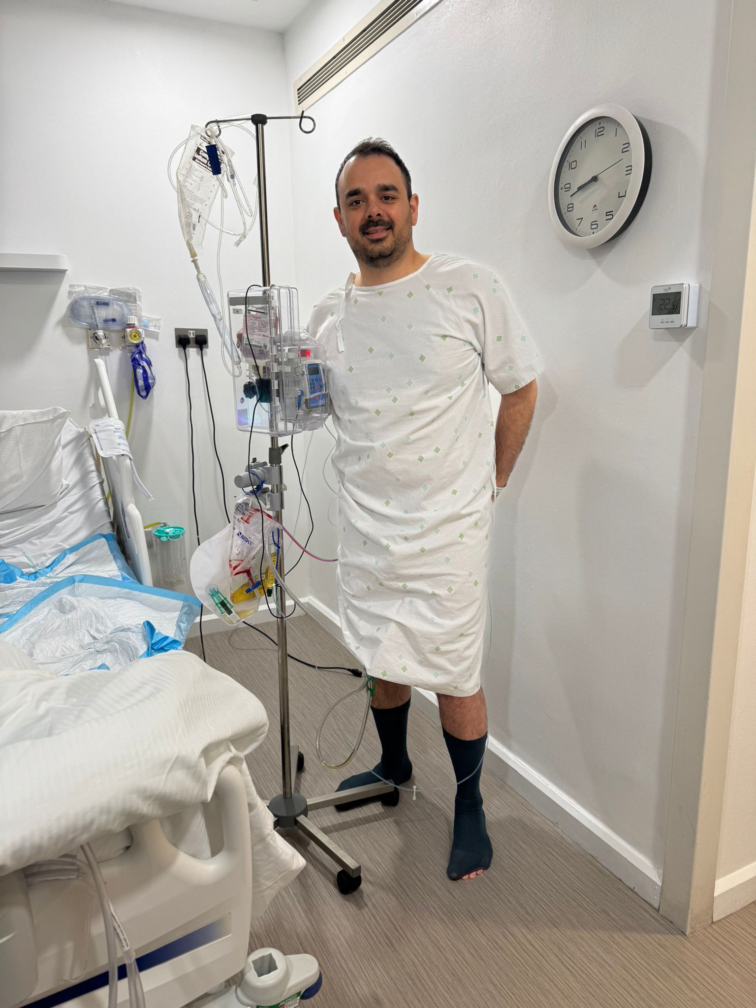 Michael standing in hospital following reconstruction surgery